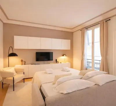 Un ou plusieurs lits dans un hébergement de l'établissement Champs Elysees - Deluxe apartment with lift for 4