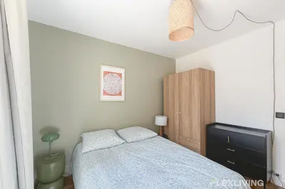 Un ou plusieurs lits dans un hébergement de l'établissement Charming 27m one-bedroom apartment in Paris 20 with shared terrace