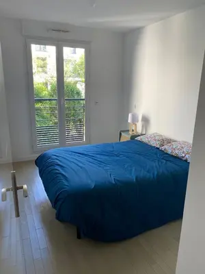 Un ou plusieurs lits dans un hébergement de l'établissement Appartement 3 pièces - Proche Paris
