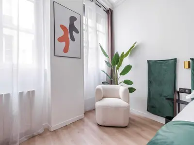 Un ou plusieurs lits dans un hébergement de l'établissement Charming duplex - 2BR 6P - Saint Germain