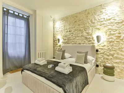 Un ou plusieurs lits dans un hébergement de l'établissement Cozy apartment - 1BR 2P - Grenelle Eiffel Tour