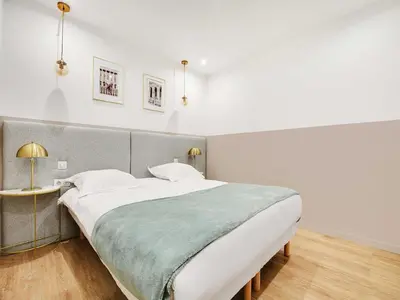 Un ou plusieurs lits dans un hébergement de l'établissement Comfort apartment 1BD 4P with AC - Near Montmartre