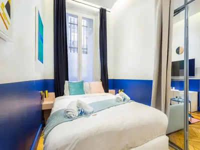 Un ou plusieurs lits dans un hébergement de l'établissement Moderne apartment - 1BR 4P - Champs-Élysées