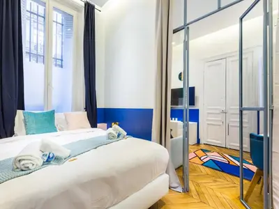 Un ou plusieurs lits dans un hébergement de l'établissement Moderne apartment - 1BR 4P - Champs-Élysées
