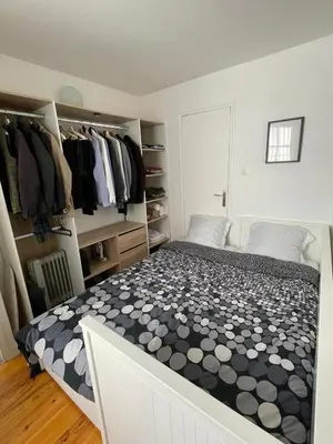 Un ou plusieurs lits dans un hébergement de l'établissement Charmant deux pièces en plein cœur de Paris