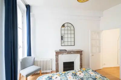 Un ou plusieurs lits dans un hébergement de l'établissement Superbe appartement Notre-Dame