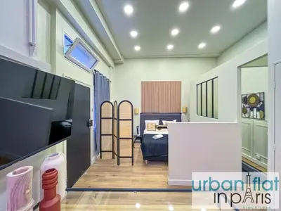 Un ou plusieurs lits dans un hébergement de l'établissement UrbanFlat 05 - Courtyard Apartment in Central Paris