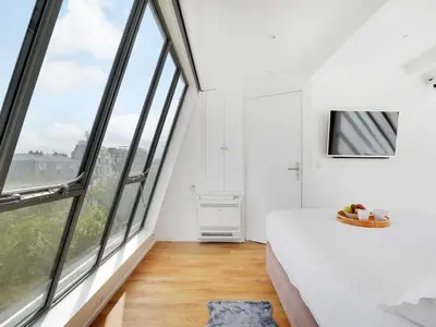 Un ou plusieurs lits dans un hébergement de l'établissement Exceptional triplex with terrace - Montmartre