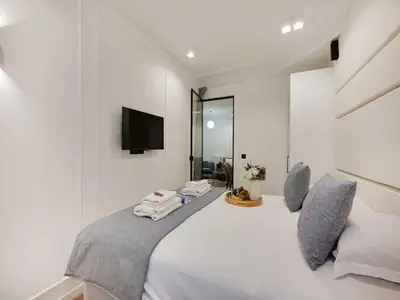 Un ou plusieurs lits dans un hébergement de l'établissement Amazing Apartment - 2BR 6P - Gare Saint-Lazare