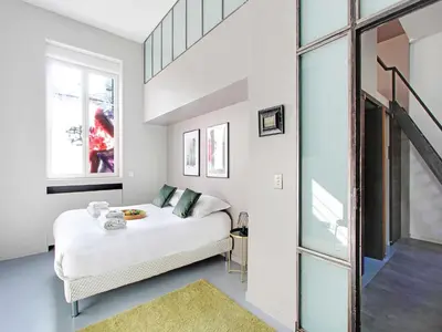 Un ou plusieurs lits dans un hébergement de l'établissement Magnificent apartment - 2BR 7P - Les Buttes Chaumont