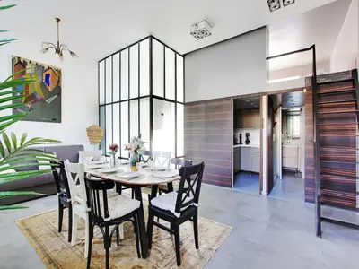 Coin salon dans l'établissement Magnificent apartment - 2BR 7P - Les Buttes Chaumont