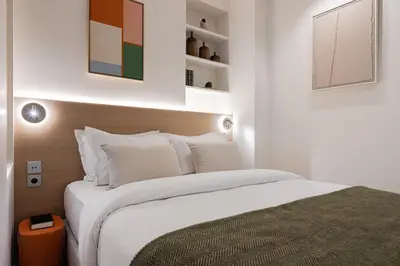 Un ou plusieurs lits dans un hébergement de l'établissement La Suite - Voltaire III - LOFT with AC