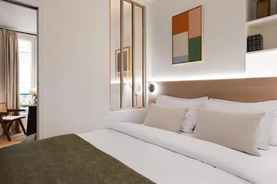 Un ou plusieurs lits dans un hébergement de l'établissement La Suite - Voltaire III - LOFT with AC