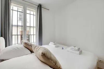 Un ou plusieurs lits dans un hébergement de l'établissement Cosy apartment - 1BR-4P - Place de la Nation