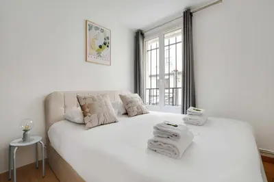 Un ou plusieurs lits dans un hébergement de l'établissement Cosy apartment - 1BR-4P - Place de la Nation