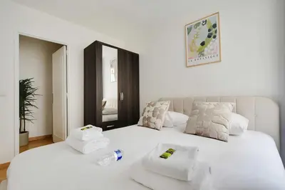 Un ou plusieurs lits dans un hébergement de l'établissement Cosy apartment - 1BR-4P - Place de la Nation