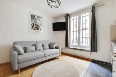 Coin salon dans l'établissement Cosy apartment - 1BR-4P - Place de la Nation
