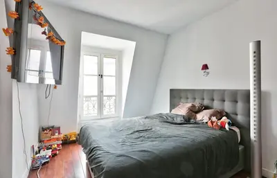 Un ou plusieurs lits dans un hébergement de l'établissement Appartement Chic et central