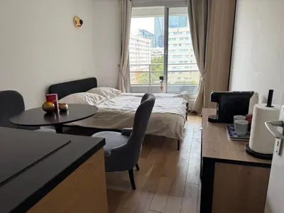 Un ou plusieurs lits dans un hébergement de l'établissement Appartement cosy à Paris en métro -balcon & wifi