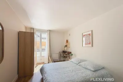 Un ou plusieurs lits dans un hébergement de l'établissement Charming 16m Studio in Paris 20 with shared terrace