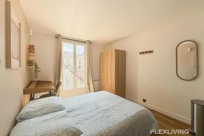 Un ou plusieurs lits dans un hébergement de l'établissement Charming 16m Studio in Paris 20 with shared terrace