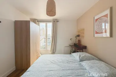 Un ou plusieurs lits dans un hébergement de l'établissement Charming 16m Studio in Paris 20 with shared terrace