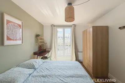 Un ou plusieurs lits dans un hébergement de l'établissement Charming 16m Studio in Paris 20 with shared terrace
