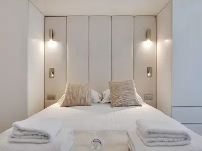 Un ou plusieurs lits dans un hébergement de l'établissement Chic apartment - 1BR 4P - République