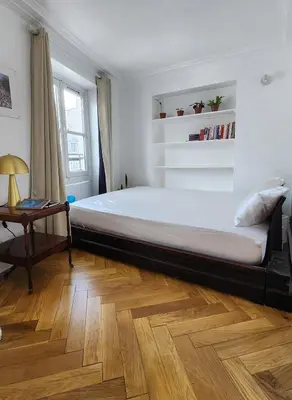 Un ou plusieurs lits dans un hébergement de l'établissement Elegant Haussmann apartment 50m G Lafayette
