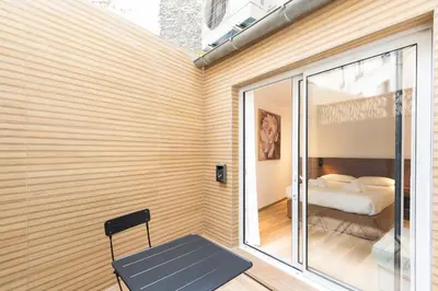 Un ou plusieurs lits dans un hébergement de l'établissement Les Suites Tour Eiffel
