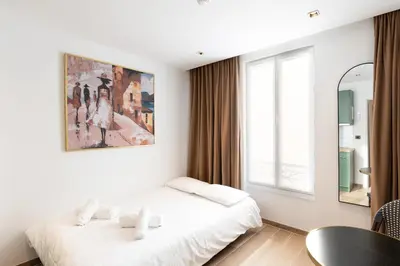 Un ou plusieurs lits dans un hébergement de l'établissement Les Suites Tour Eiffel