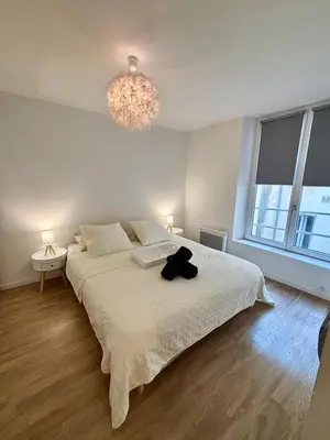 Un ou plusieurs lits dans un hébergement de l'établissement Appartement Odéon Paris