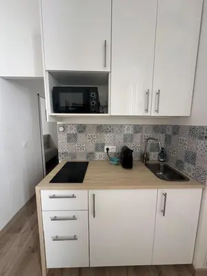 Cuisine ou kitchenette dans l'établissement A proximité immédiate de la Tour Eiffel