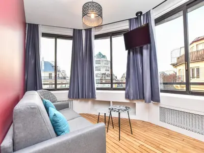 Coin salon dans l'établissement Bright apartment - 1BR 4P - near Opéra Garnier