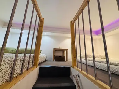 Un ou plusieurs lits dans un hébergement de l'établissement Cozy loft near the Marais district
