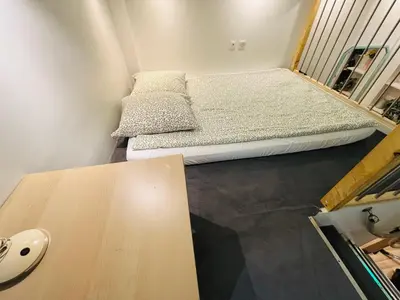 Un ou plusieurs lits dans un hébergement de l'établissement Cozy loft near the Marais district