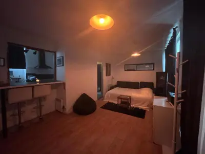 Un ou plusieurs lits dans un hébergement de l'établissement Grand Studio Paris Bastille