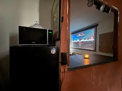Télévision ou salle de divertissement dans l'établissement Grand Studio Paris Bastille