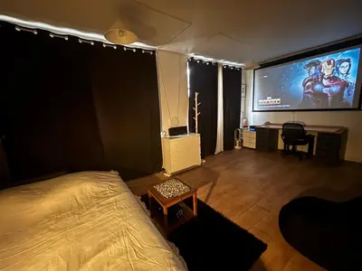 Télévision ou salle de divertissement dans l'établissement Grand Studio Paris Bastille