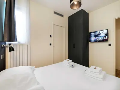 Un ou plusieurs lits dans un hébergement de l'établissement Modern apartment - 2BR 8P - near Opéra Garnier
