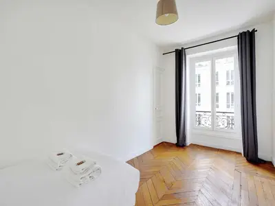 Un ou plusieurs lits dans un hébergement de l'établissement Charming Flat -2BR 6P- Montorgueil