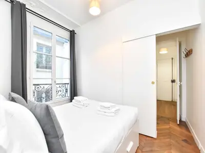 Un ou plusieurs lits dans un hébergement de l'établissement Charming Flat -2BR 6P- Montorgueil