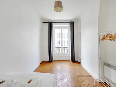 Un ou plusieurs lits dans un hébergement de l'établissement Charming Flat -2BR 6P- Montorgueil