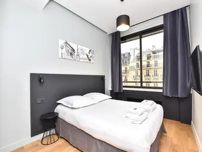 Un ou plusieurs lits dans un hébergement de l'établissement Chic apartment - 1BR 4P - near Opéra Garnier