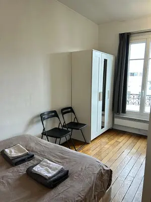 Un ou plusieurs lits dans un hébergement de l'établissement Sunshine Studio near Eiffel Tower