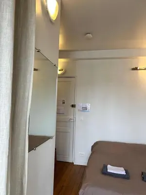 Un ou plusieurs lits dans un hébergement de l'établissement Sunshine Studio near Eiffel Tower