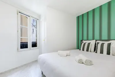 Un ou plusieurs lits dans un hébergement de l'établissement Appartement agréable Montmartre - Sacré-Cœur