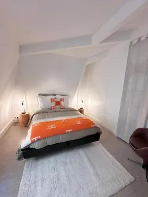 Un ou plusieurs lits dans un hébergement de l'établissement Champs-Élysées Montaigne luxe