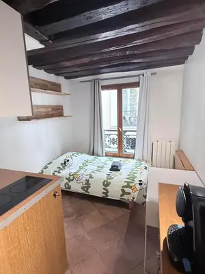 Un ou plusieurs lits dans un hébergement de l'établissement Paris Marais Sunshine Studio