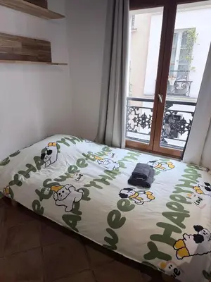 Un ou plusieurs lits dans un hébergement de l'établissement Paris Marais Sunshine Studio